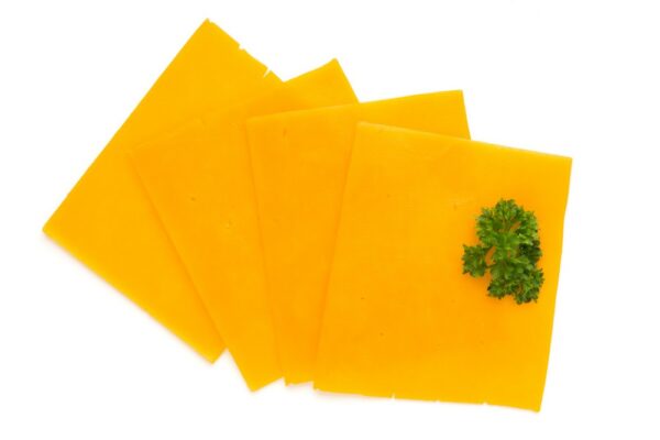 Cheddar cheese slice isolated on the white background.