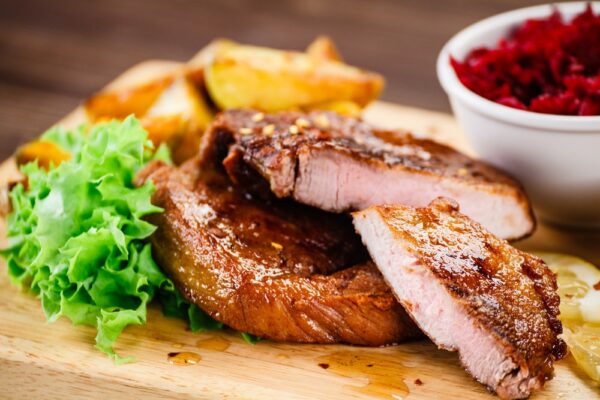 Grilled beefsteak with baked potatoes and beetroots